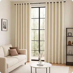 Cream curtains with white sofa